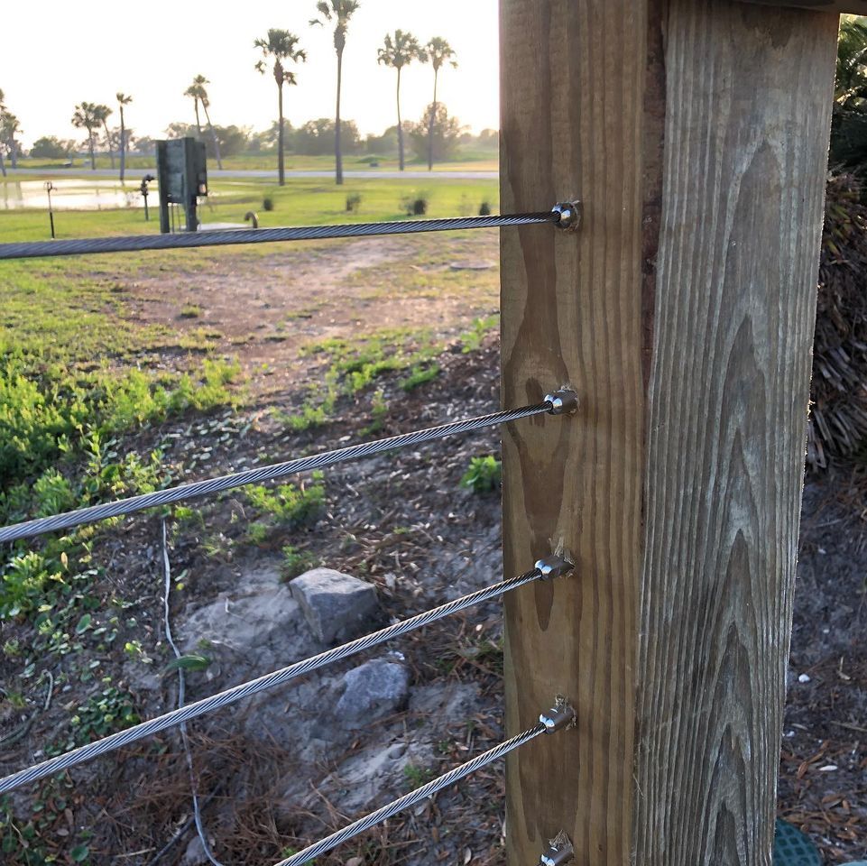 cable attached to wooden post