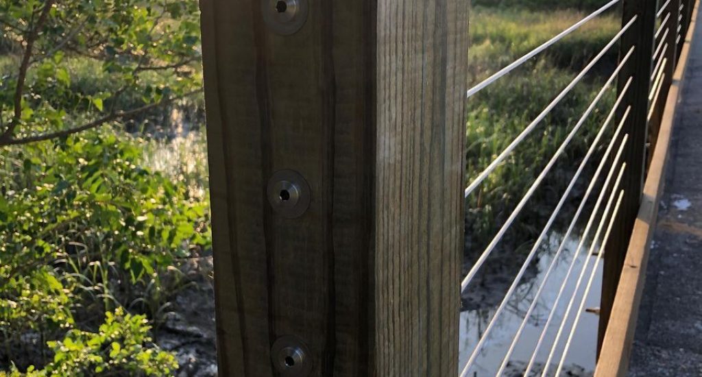 cable attached to wooden post